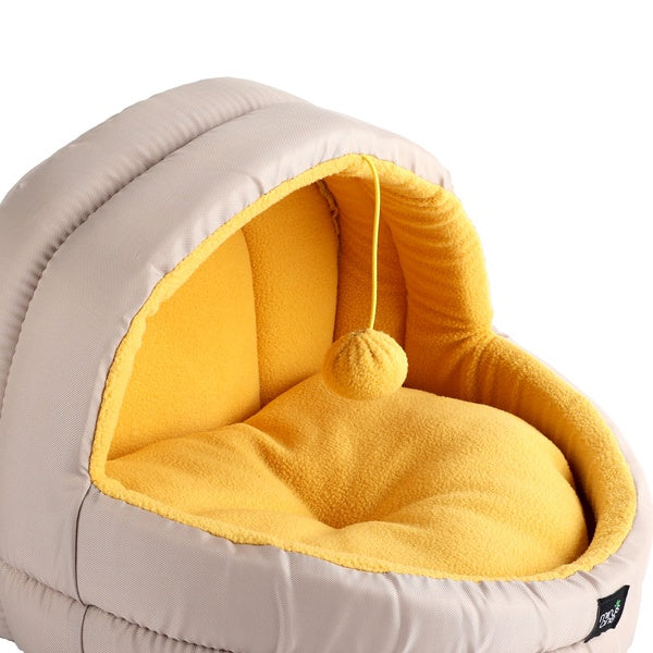 Close view of the yellow fleece cushion and hanging toy inside the Minus One cat cave